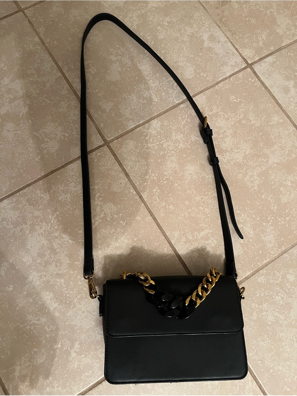Black Crossbody Bag with Gold Chain Accent